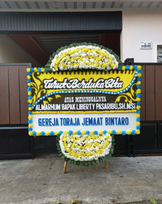 Papan Bunga Duka di Parmonangan